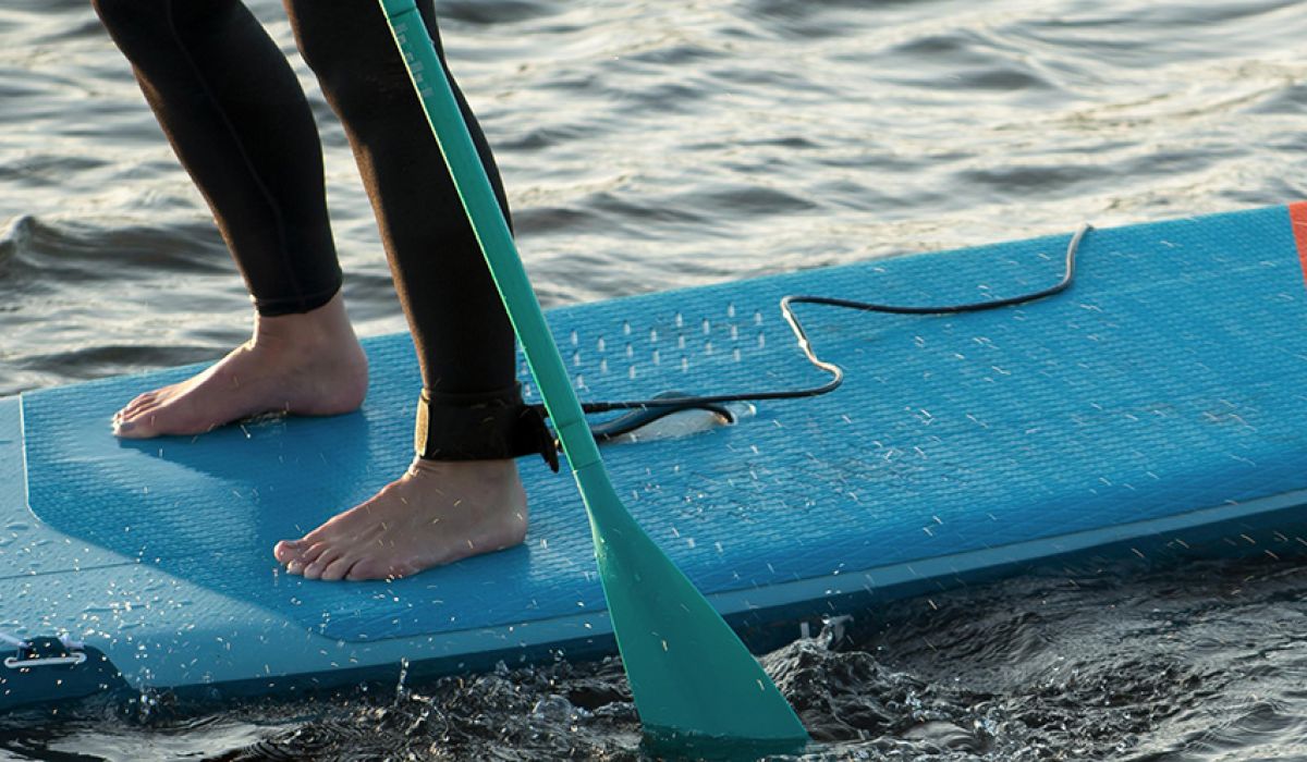 Ankle leash to a board