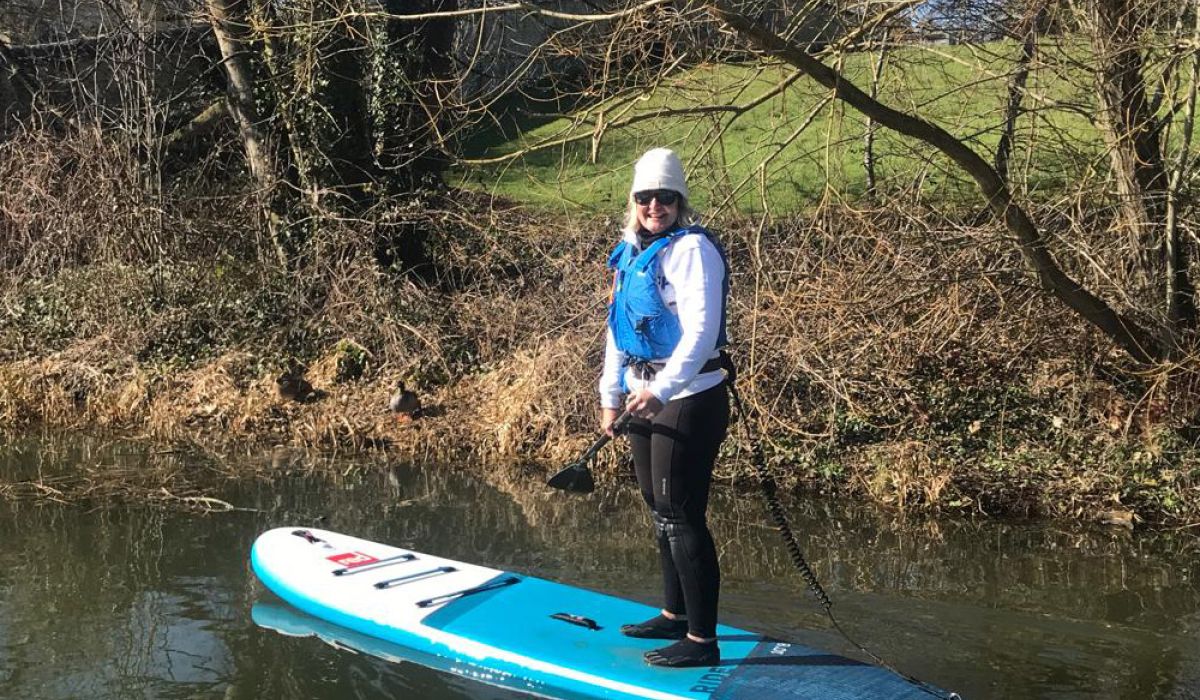 Moira doing paddleboarding in the winter